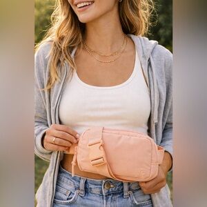 New GapFit 100% Recycled Belt Bag in featured Powder Peach color